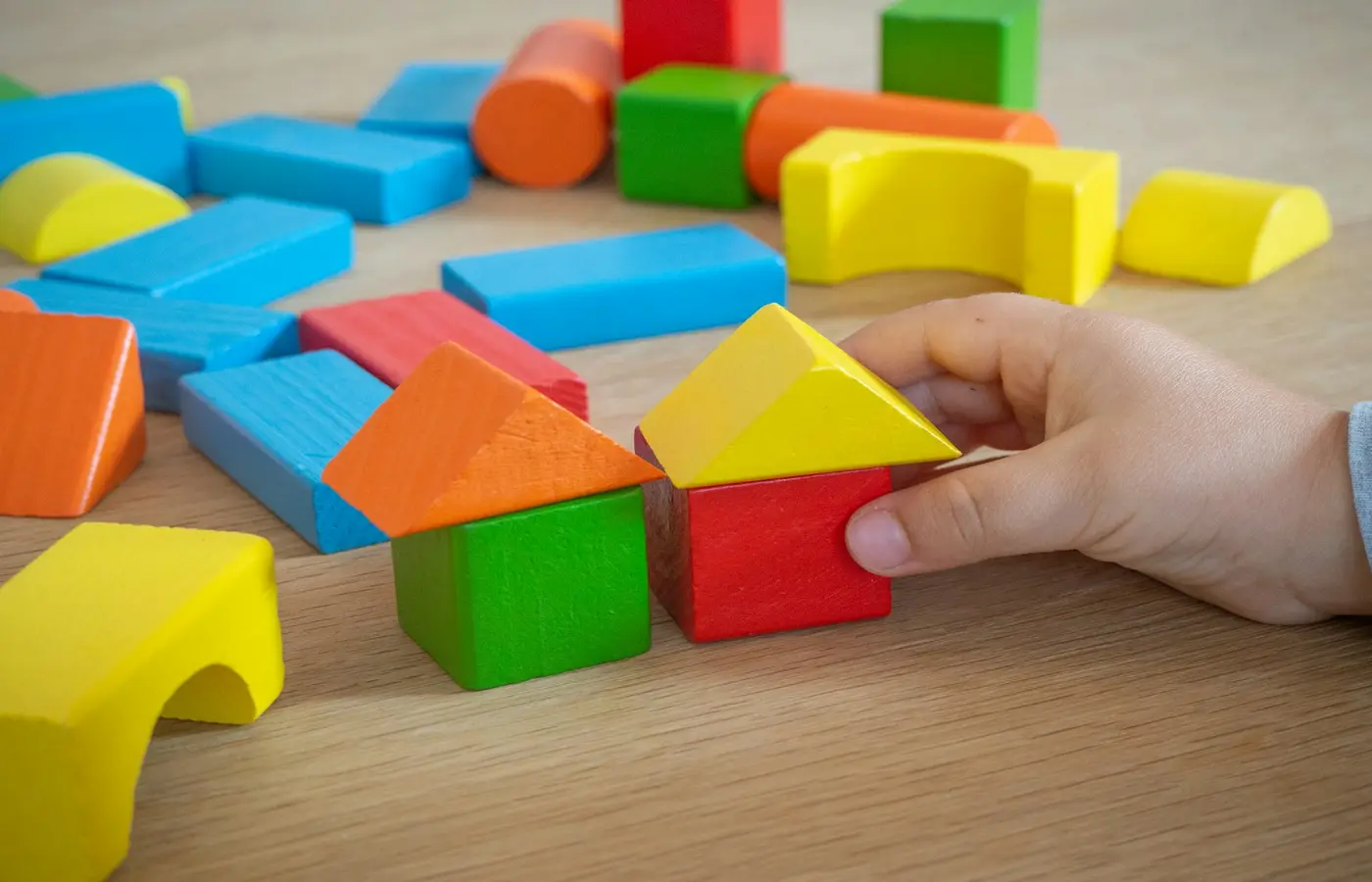 Child building a block enclosure