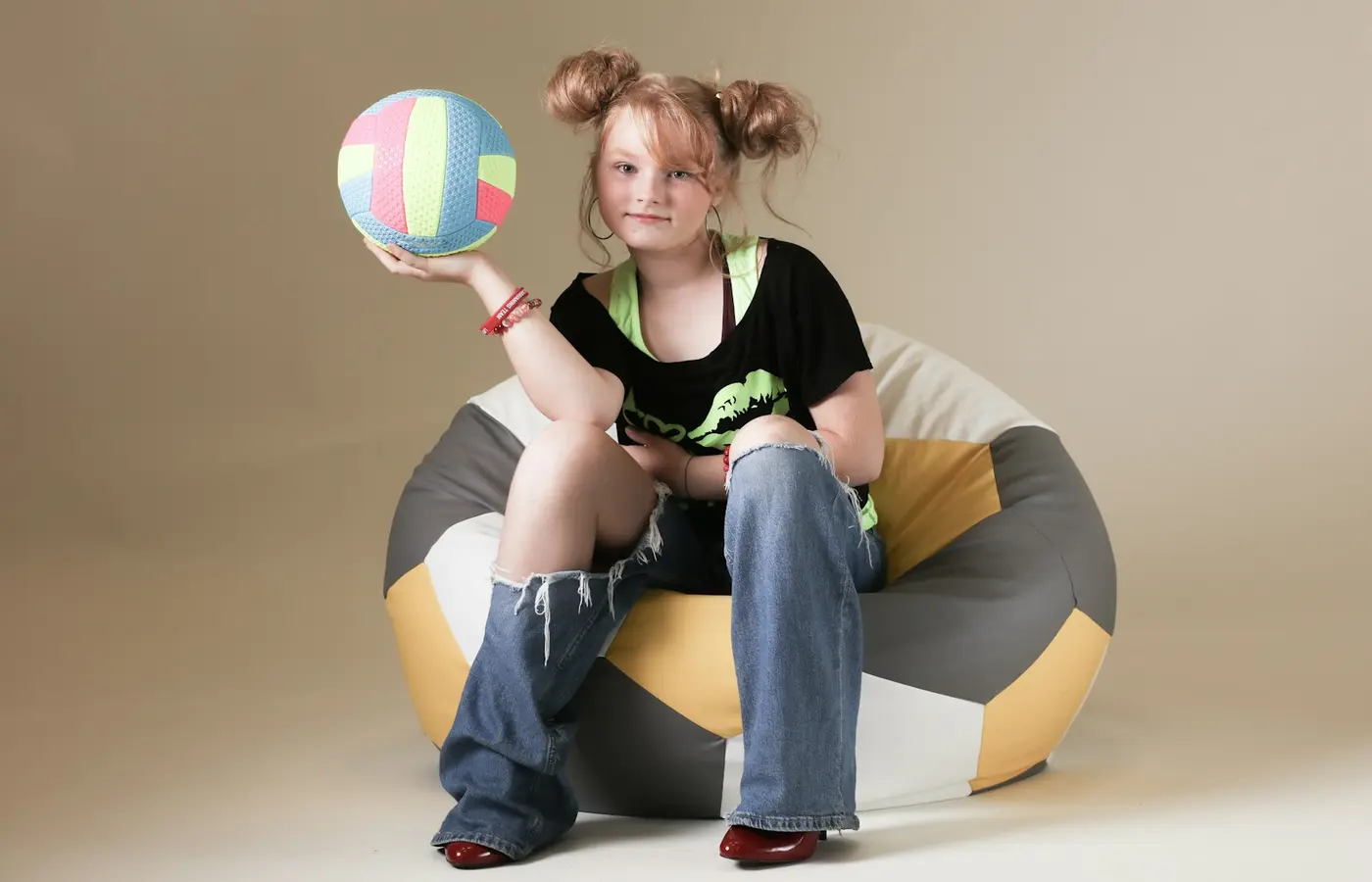 Child tossing soft beanbags