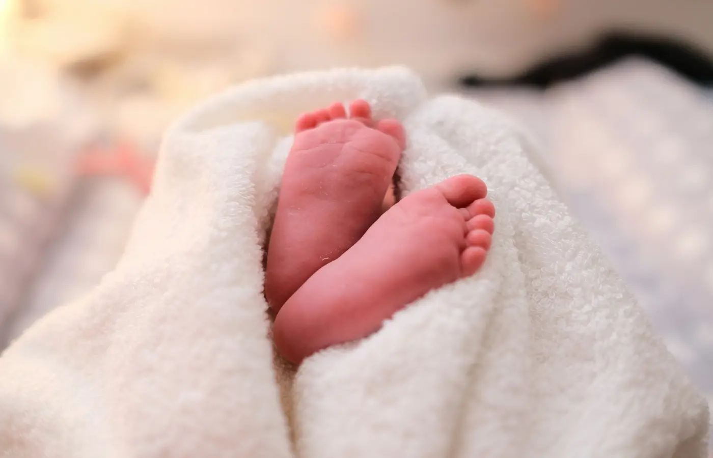 A newborn with a simple rattle during supervised awake play
