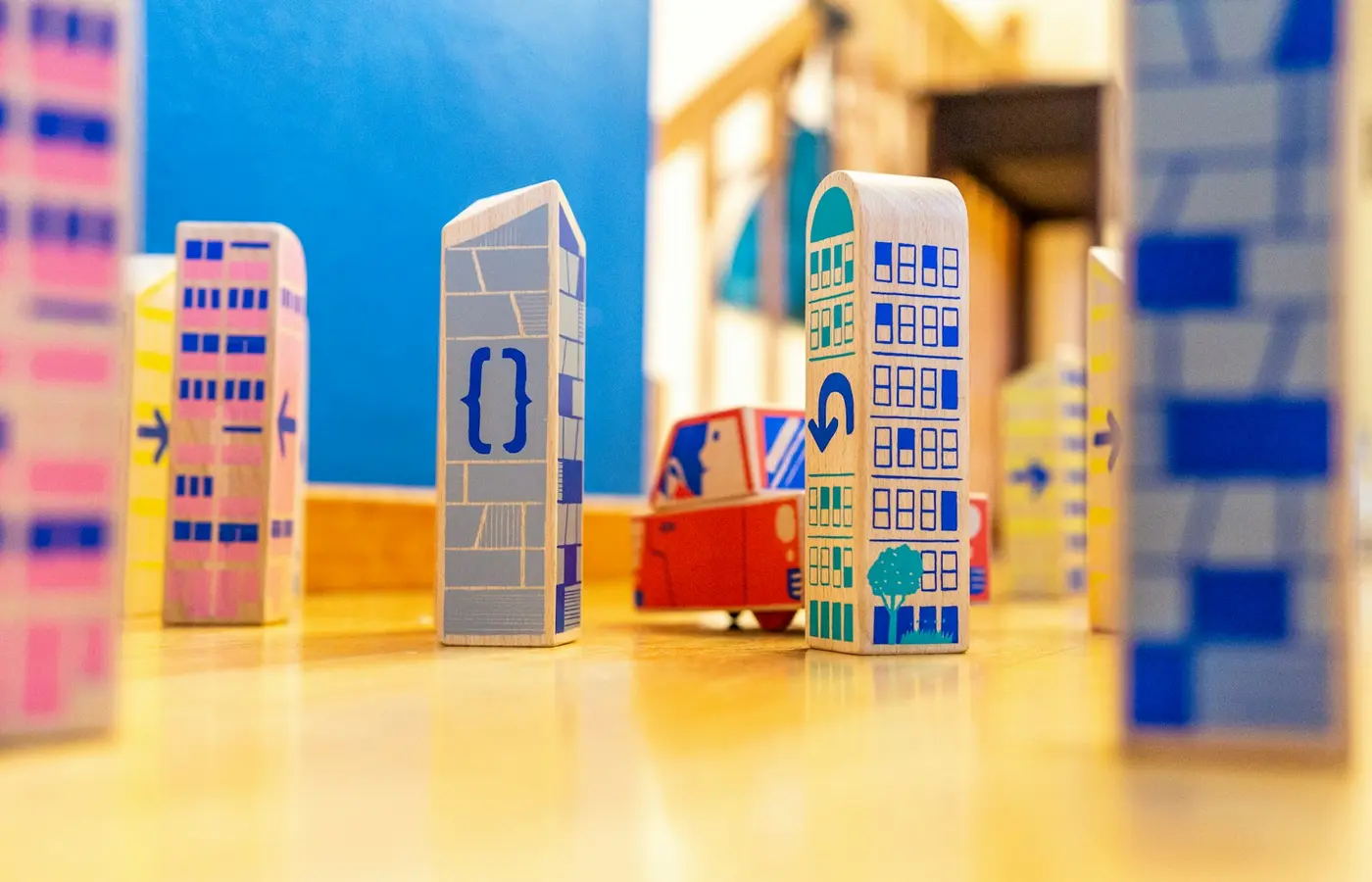 Modular toy town pieces arranged for floor play