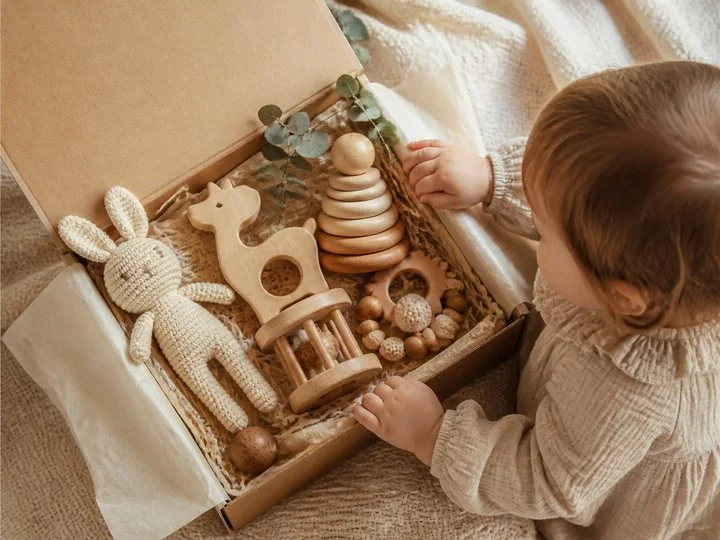 A durable selection of blocks, vehicles, fabric, books, and art materials prepared as gifts